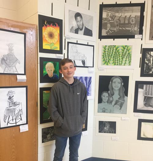 Jayden Staats with his still life drawing